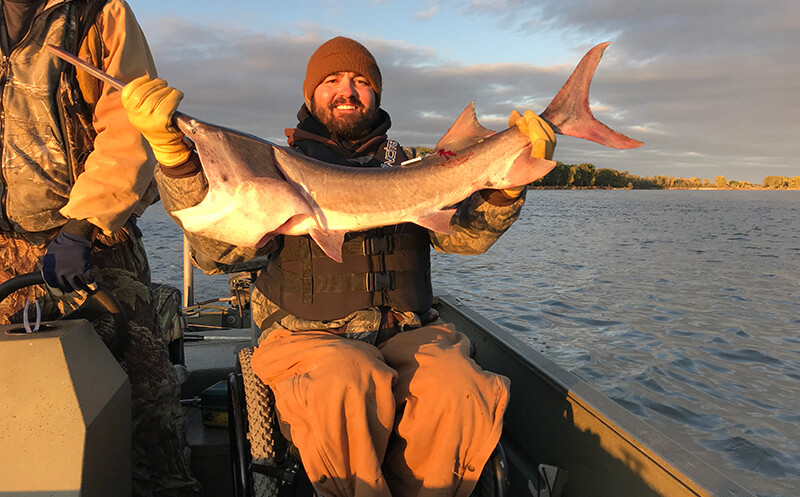 Craig Hospital grad Adam Fisher fishing