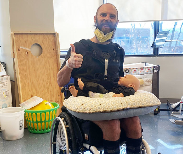 Robbie practicing parenting from a wheelchair at Craig Hospital