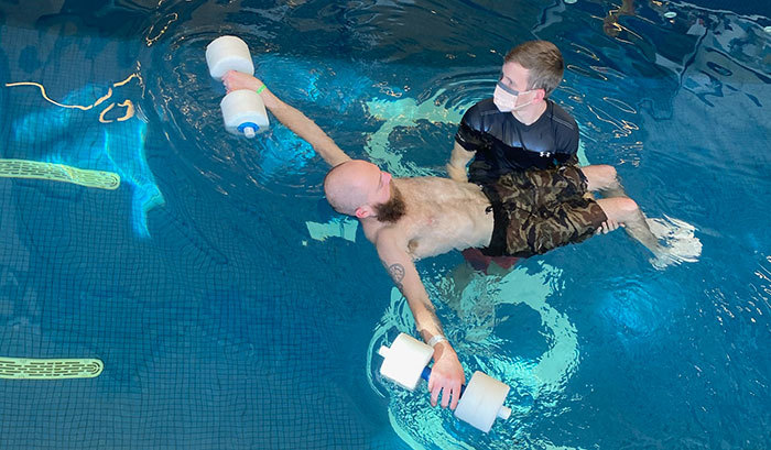 Robbie in pool therapy at Craig Hospital