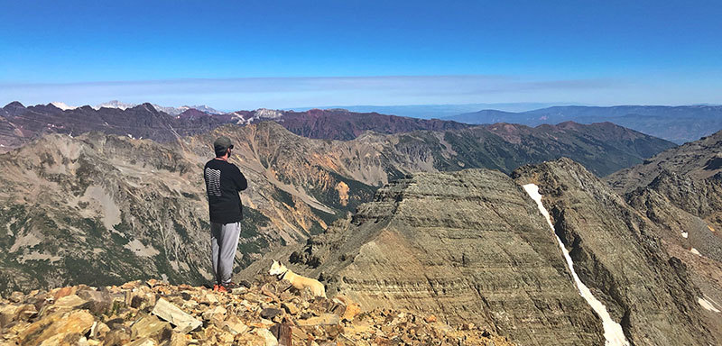 James Hall on summit of a Colorado mountain
