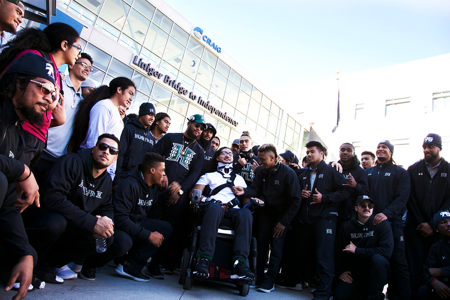 The University of Hawaii football team visits injured teammate, offering motivation & support during spinal cord injury rehabilitation at Craig Hospital.