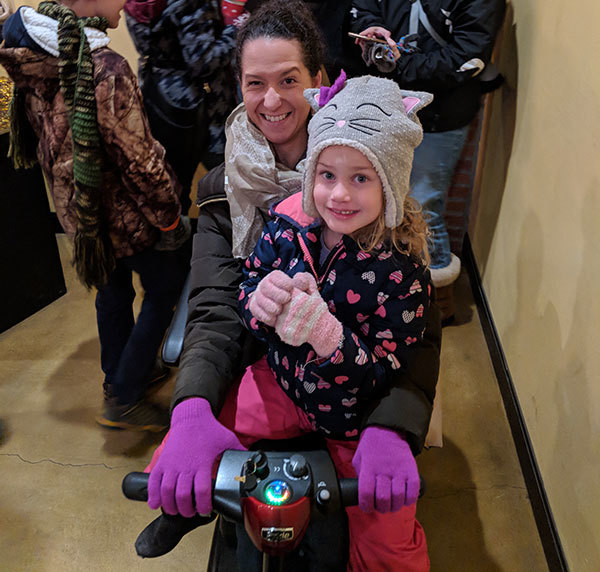 Molei Wright using a scooter